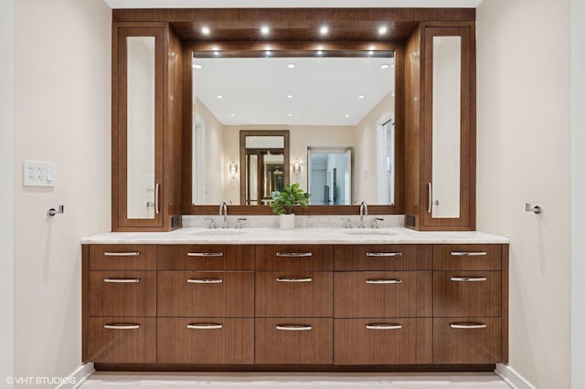 1327 N Sutton Pl, Chicago, IL 60610 - bathroom featuring double vanity and baseboards