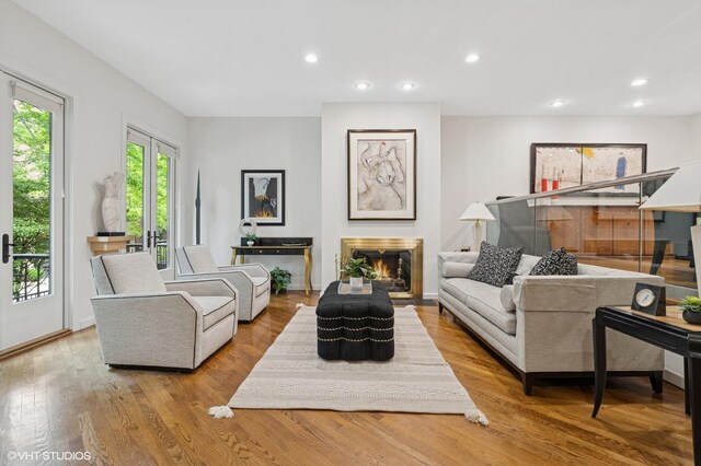 1327 N Sutton Pl, Chicago, IL 60610 - living area featuring wood finished floors, recessed lighting, and a lit fireplace