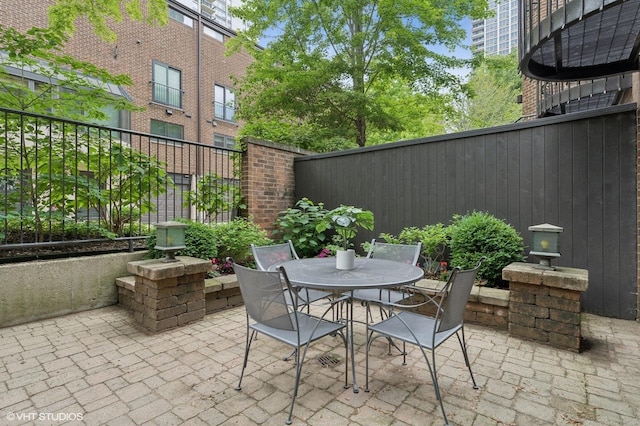 1327 N Sutton Pl, Chicago, IL 60610 - fenced backyard with a patio and outdoor dining space