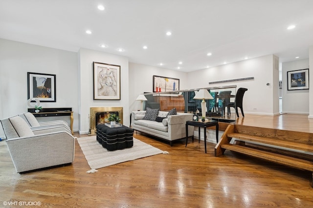 1327 N Sutton Pl, Chicago, IL 60610 - living area featuring recessed lighting, wood finished floors, and a lit fireplace
