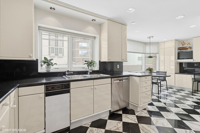 1327 N Sutton Pl, Chicago, IL 60610 - kitchen with stainless steel dishwasher, healthy amount of natural light, tasteful backsplash, dark countertops, and recessed lighting