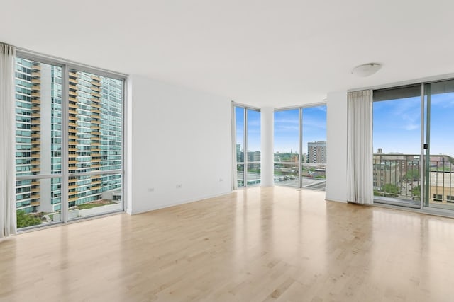1640 Maple Ave Unit 1202, Evanston, IL 60201 - unfurnished room with floor to ceiling windows and wood finished floors