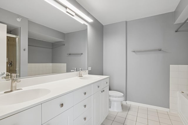 1640 Maple Ave Unit 1202, Evanston, IL 60201 - bathroom featuring double vanity, tile patterned floors, a garden tub, and a shower with shower door