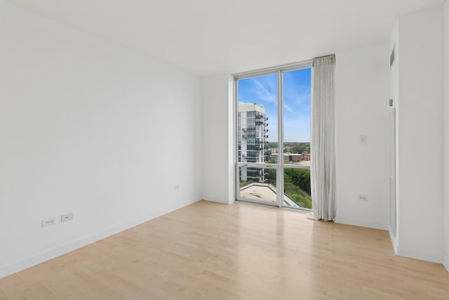 1640 Maple Ave Unit 1202, Evanston, IL 60201 - unfurnished room featuring expansive windows and light wood-style flooring