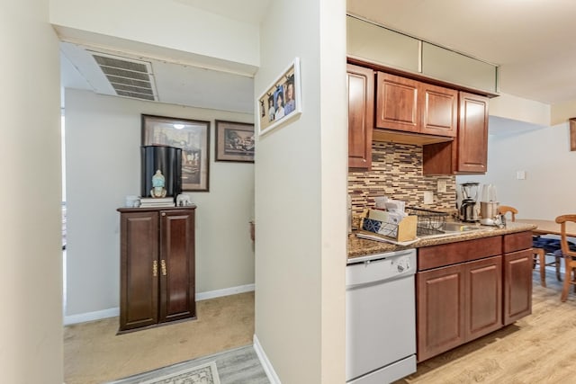 6135 W 94th St Unit A1, Oak Lawn, IL 60453 - kitchen featuring white dishwasher, tasteful backsplash, light wood finished floors, and brown cabinetry