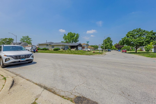 6135 W 94th St Unit A1, Oak Lawn, IL 60453 - view of asphalt road featuring street lighting, a residential view, curbs, and sidewalks