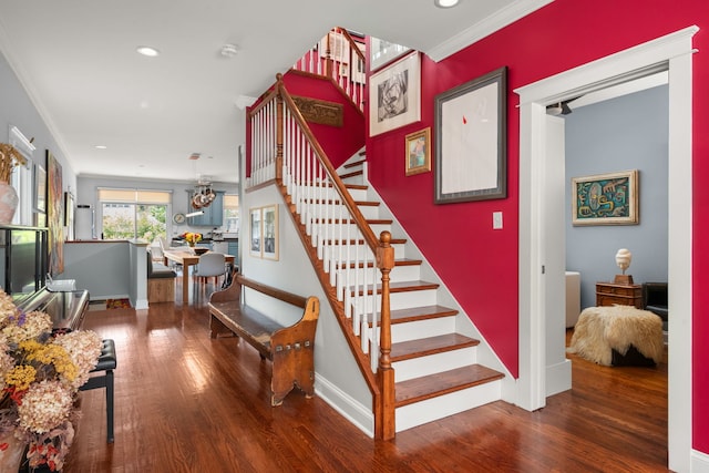 637 Highland Ave, Oak Park, IL 60304 - stairs featuring wood finished floors, ornamental molding, recessed lighting, and a chandelier