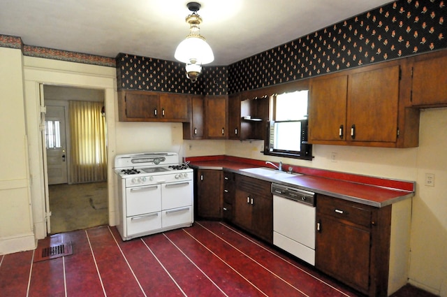 4816 Auburn St, Rockford, IL 61101 - kitchen with white appliances, dark tile patterned floors, and pendant lighting