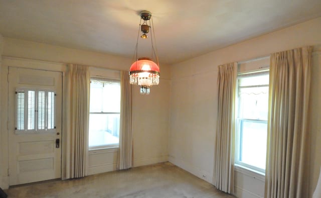 4816 Auburn St, Rockford, IL 61101 - unfurnished dining area with carpet flooring and baseboards