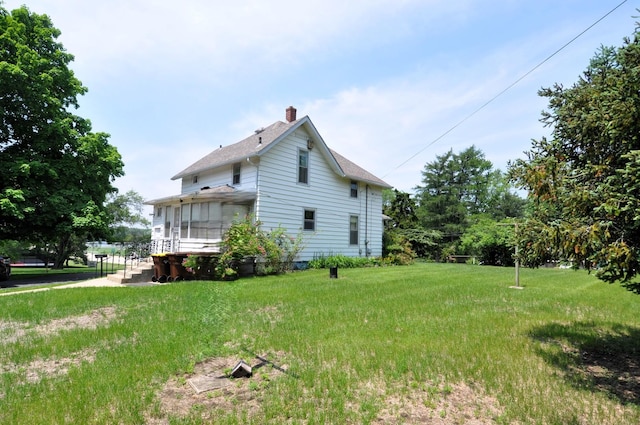 4816 Auburn St, Rockford, IL 61101 - view of home's exterior with a chimney, roof with shingles, and a yard