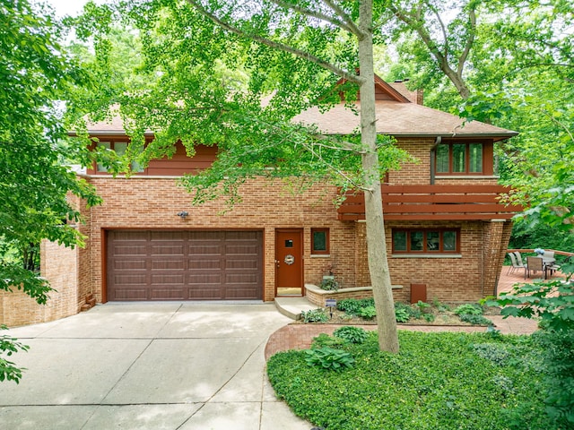 4303 Singleton Close, Rockford, IL 61114 - view of front of home with an attached garage, concrete driveway, and brick siding