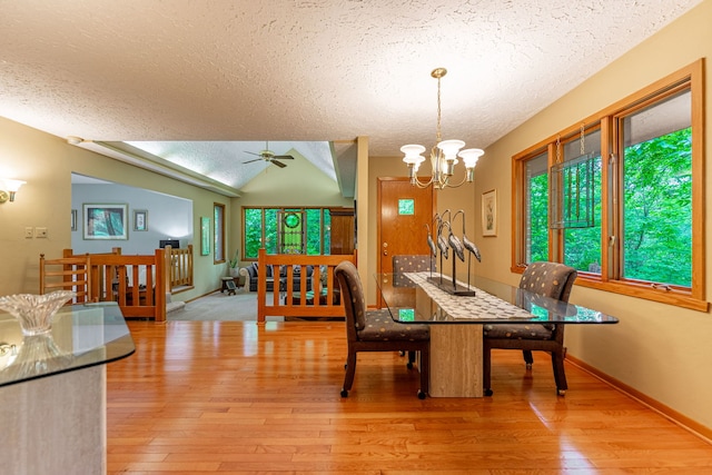 4303 Singleton Close, Rockford, IL 61114 - dining space featuring a textured ceiling, light wood-style floors, healthy amount of natural light, a chandelier, and a ceiling fan