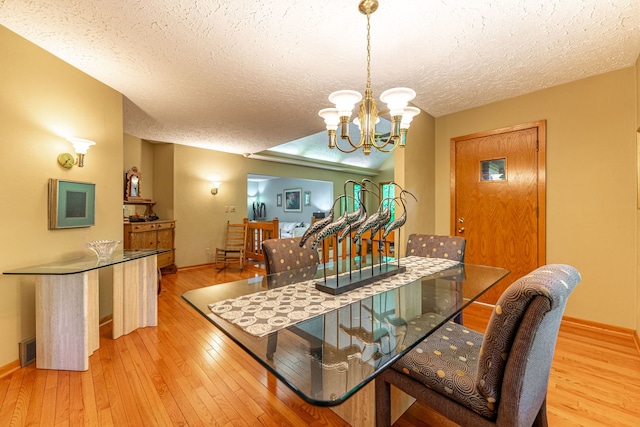4303 Singleton Close, Rockford, IL 61114 - dining room featuring hardwood / wood-style floors, a textured ceiling, and a chandelier