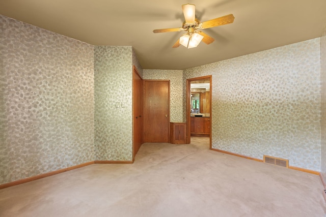 4303 Singleton Close, Rockford, IL 61114 - carpeted spare room with a ceiling fan and wallpapered walls