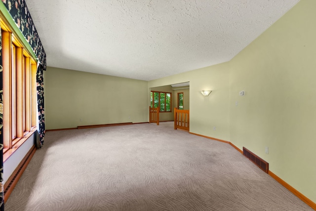 4303 Singleton Close, Rockford, IL 61114 - empty room with a textured ceiling and carpet floors