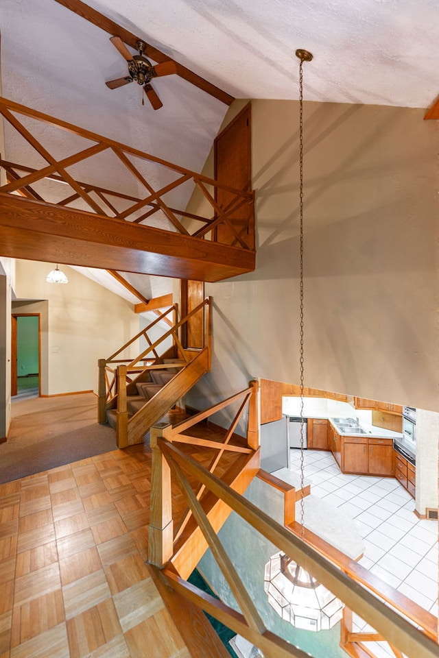 4303 Singleton Close, Rockford, IL 61114 - stairway with a ceiling fan and high vaulted ceiling