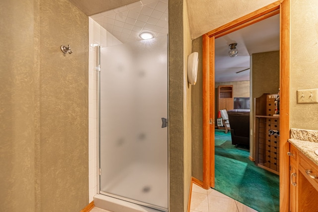 4303 Singleton Close, Rockford, IL 61114 - full bath with a textured wall, a stall shower, vanity, and tile patterned flooring