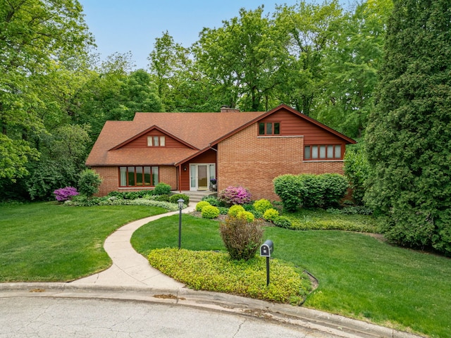 4303 Singleton Close, Rockford, IL 61114 - mid-century home with brick siding, a front yard, and roof with shingles