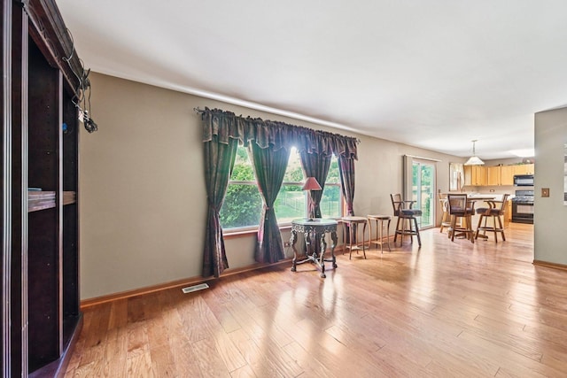 561 Ryegrass Trl, Aurora, IL 60504 - living room featuring light wood finished floors and baseboards