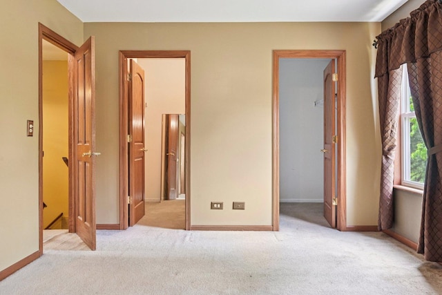 561 Ryegrass Trl, Aurora, IL 60504 - unfurnished bedroom with carpet floors, a spacious closet, and a closet