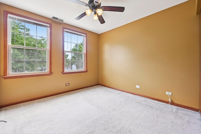 561 Ryegrass Trl, Aurora, IL 60504 - spare room with carpet flooring, healthy amount of natural light, and a ceiling fan