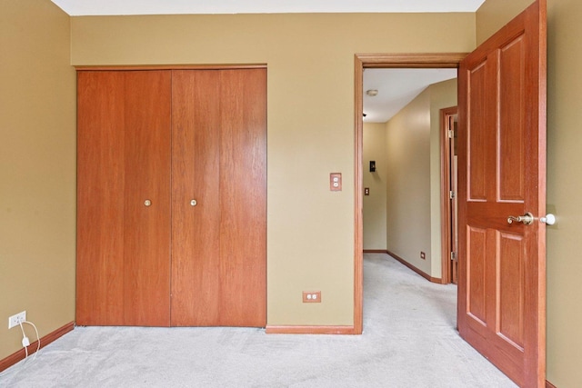 561 Ryegrass Trl, Aurora, IL 60504 - unfurnished bedroom featuring light colored carpet and a closet