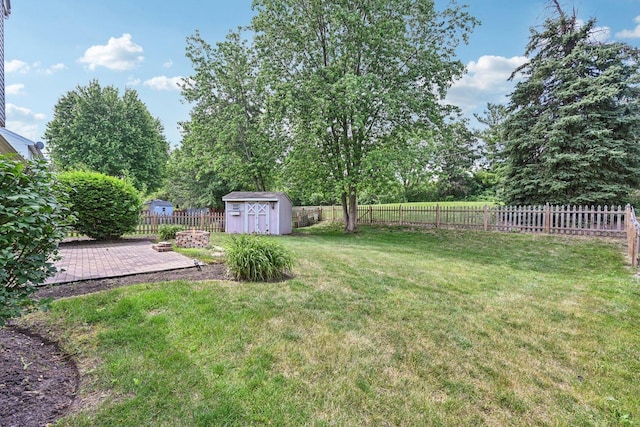 561 Ryegrass Trl, Aurora, IL 60504 - fenced backyard with a storage unit and a patio