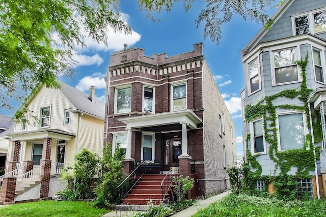 4444 N Spaulding Ave, Chicago, IL 60625 - view of front of property with brick siding and a porch