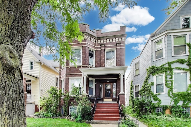 4444 N Spaulding Ave, Chicago, IL 60625 - view of front of home featuring brick siding and covered porch