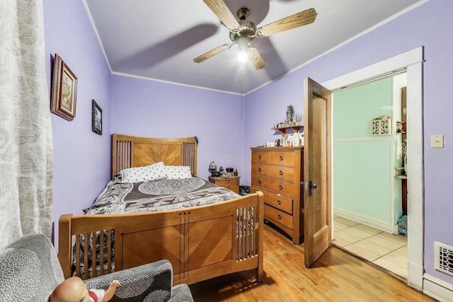 4444 N Spaulding Ave, Chicago, IL 60625 - bedroom featuring wood finished floors, ornamental molding, and a ceiling fan