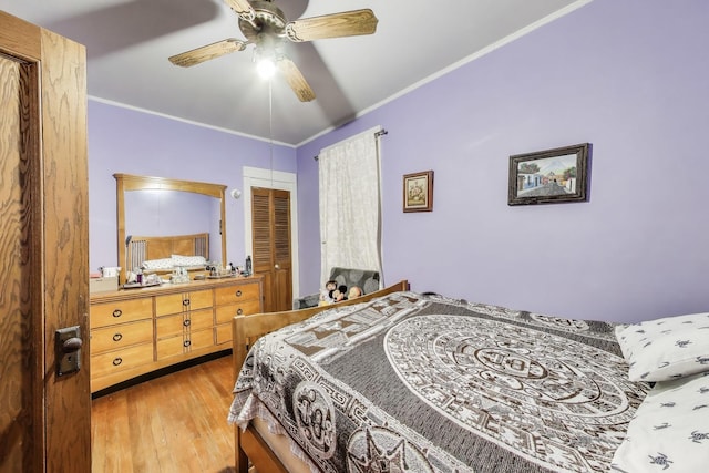 4444 N Spaulding Ave, Chicago, IL 60625 - bedroom featuring wood-type flooring, crown molding, ceiling fan, and a closet