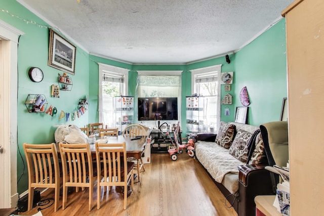4444 N Spaulding Ave, Chicago, IL 60625 - living area with a textured ceiling, wood finished floors, and ornamental molding