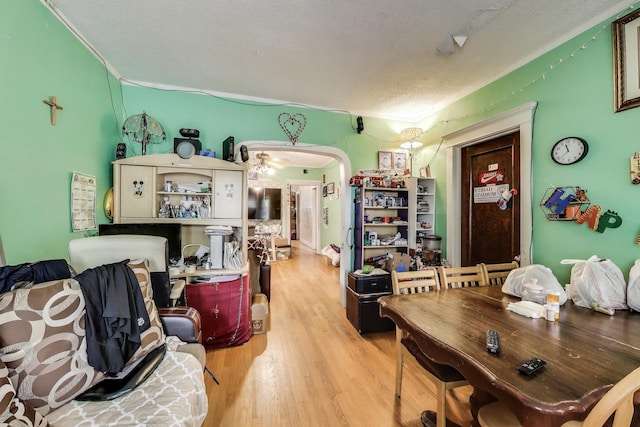 4444 N Spaulding Ave, Chicago, IL 60625 - dining area with wood finished floors, a textured ceiling, and arched walkways