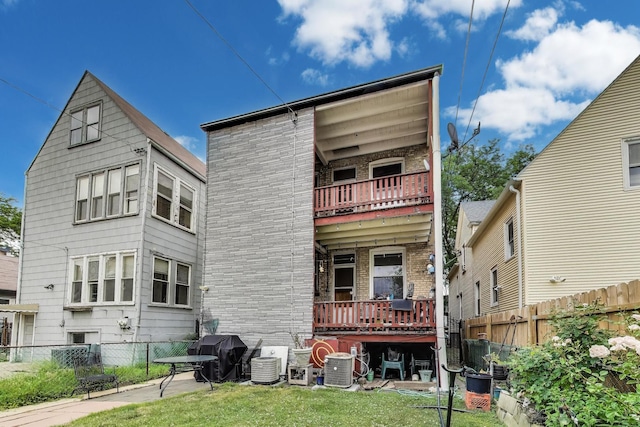 4444 N Spaulding Ave, Chicago, IL 60625 - back of property with a balcony and brick siding