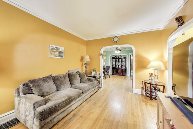 4444 N Spaulding Ave, Chicago, IL 60625 - living area with arched walkways, light wood-style flooring, and crown molding