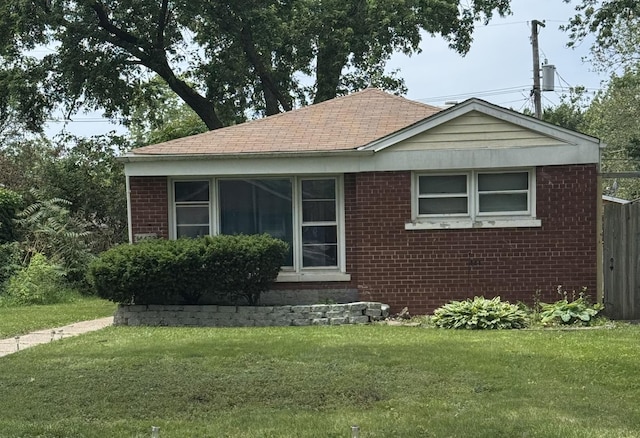 14432 Green St, Harvey, IL 60426 - view of front of house featuring brick siding and a front lawn