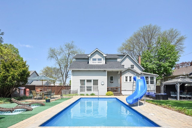 325 2nd St, Downers Grove, IL 60515 - back of house with a gazebo, a patio area, roof with shingles, and a hot tub