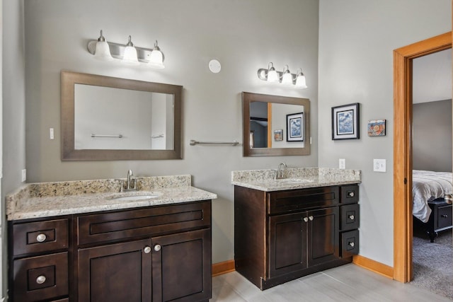 325 2nd St, Downers Grove, IL 60515 - ensuite bathroom featuring two vanities and baseboards