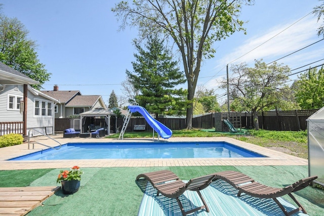 325 2nd St, Downers Grove, IL 60515 - view of swimming pool with a gazebo, a water slide, and a fenced backyard