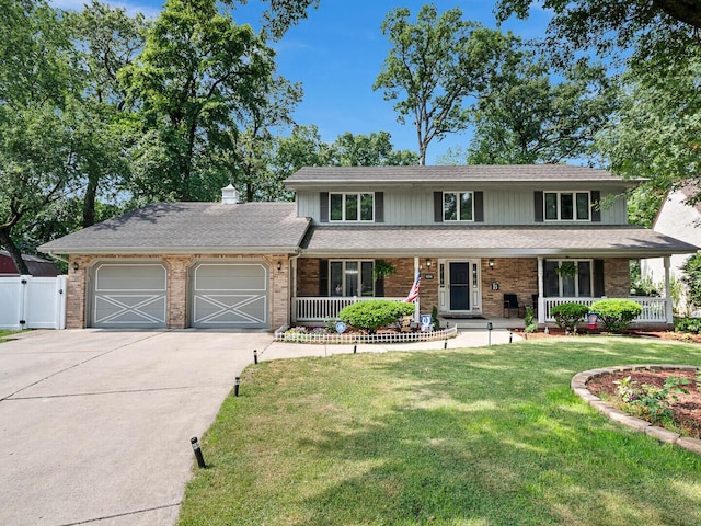 18118 Whitman Ln, Lansing, IL 60438 - traditional-style home with a garage, concrete driveway, a porch, and brick siding