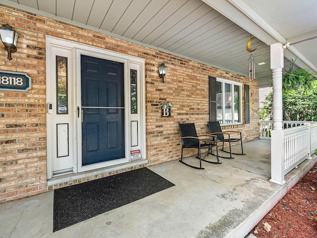 18118 Whitman Ln, Lansing, IL 60438 - entrance to property featuring covered porch and brick siding