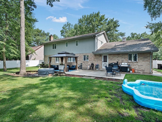 18118 Whitman Ln, Lansing, IL 60438 - back of house with an outdoor living space, a gazebo, a patio area, a chimney, and brick siding