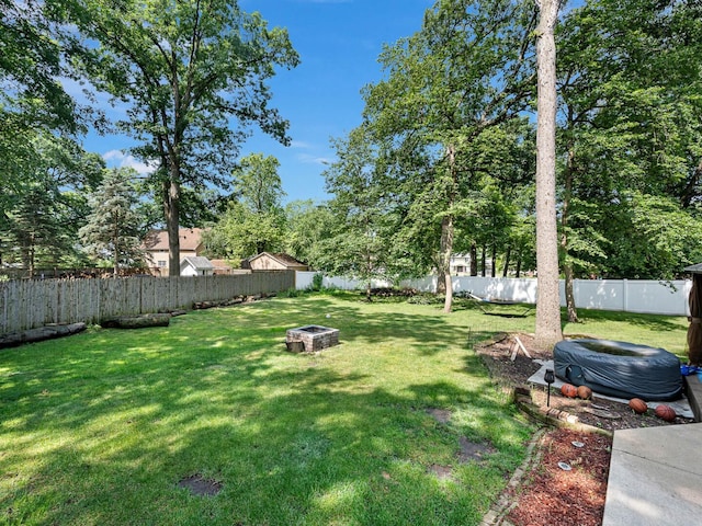 18118 Whitman Ln, Lansing, IL 60438 - fenced backyard with a fire pit
