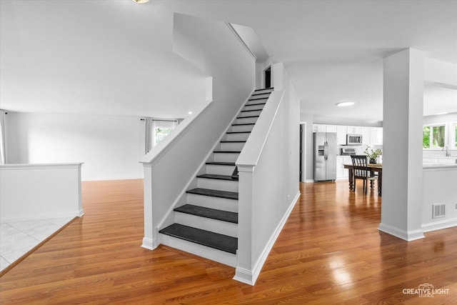 2164 Clementi Ln, Aurora, IL 60503 - stairway with wood finished floors and baseboards