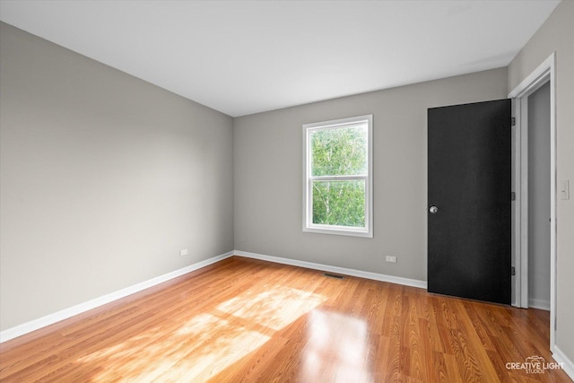 2164 Clementi Ln, Aurora, IL 60503 - unfurnished bedroom with light wood finished floors and baseboards