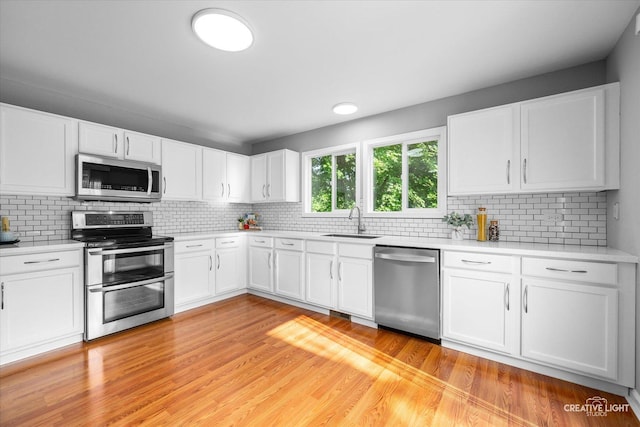 2164 Clementi Ln, Aurora, IL 60503 - kitchen with stainless steel appliances, light countertops, and tasteful backsplash