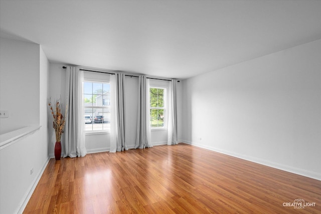 2164 Clementi Ln, Aurora, IL 60503 - unfurnished room with light wood-type flooring and baseboards