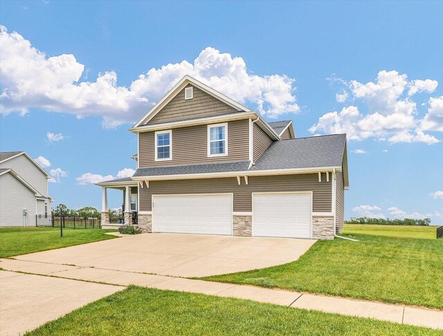 1908 Littlefield Ln, Mahomet, IL 61853 - craftsman-style house with stone siding, concrete driveway, and a garage