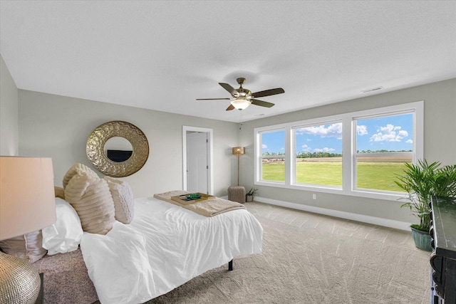 1908 Littlefield Ln, Mahomet, IL 61853 - carpeted bedroom featuring baseboards and a ceiling fan