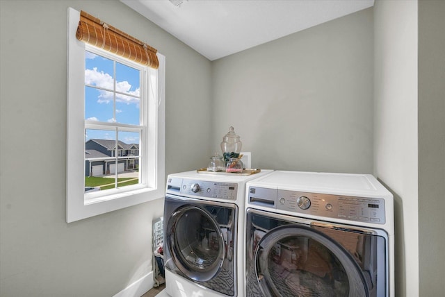 1908 Littlefield Ln, Mahomet, IL 61853 - laundry room featuring washer and dryer and baseboards